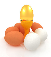 Image showing Eggs and gold easter egg on egg cups 