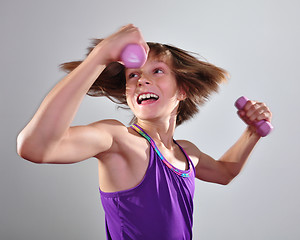 Image showing child exercising with dumbells