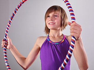 Image showing child exercising with a hoop