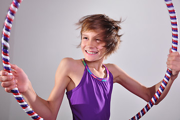 Image showing child exercising with a hoop