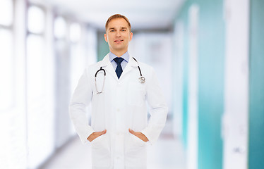 Image showing smiling male doctor in white coat with stethoscope