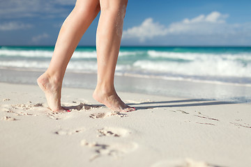 Image showing closeup of woman legs on sea shore