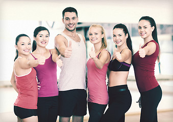 Image showing group of people in the gym showing thumbs up