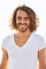 Image showing smiling man in white blank shirt outdoors