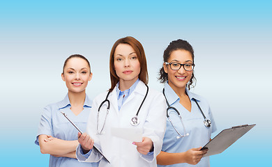 Image showing calm female doctor with clipboard