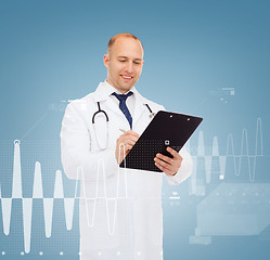 Image showing smiling male doctor with clipboard and stethoscope