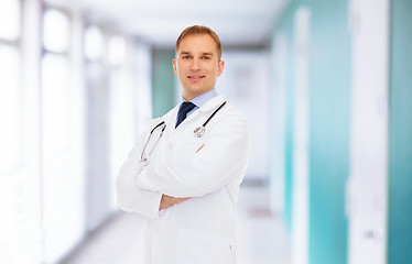 Image showing smiling male doctor in white coat with stethoscope