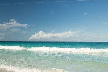 Image showing blue sea or ocean, white sand and sky with clouds