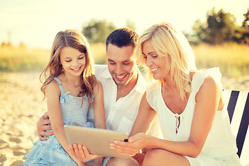 Image showing smiling family at beach with tablet pc computer