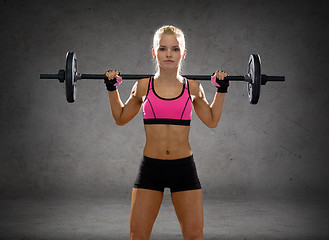 Image showing sporty woman exercising with barbell