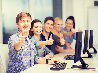 Image showing students with computer monitor showing thumbs up