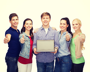 Image showing smiling students with laptop computer