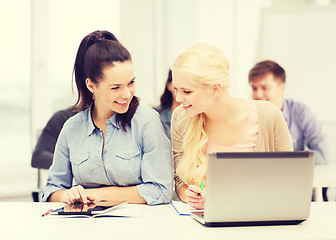 Image showing students with laptop, tablet pc and notebooks