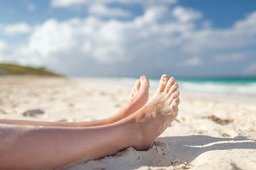 Image showing closeup of woman legs on sea shore