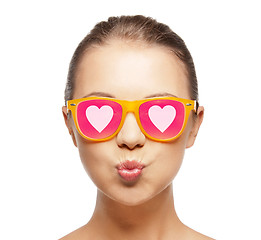 Image showing girl in pink sunglasses blowing kiss