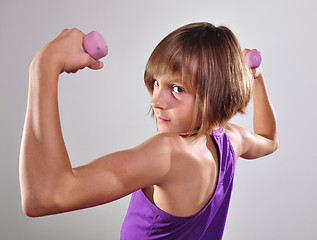 Image showing child exercising with dumbells