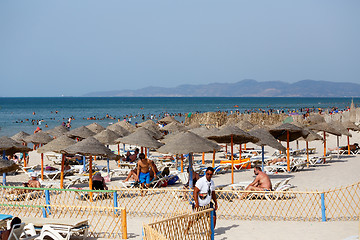 Image showing People relaxing at private sandy tunisian beach
