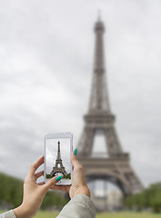 Image showing Taken pictures Eiffel Tower with mobile phone