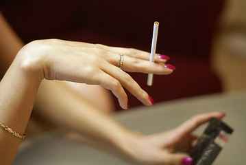 Image showing Young woman hand with cigarette