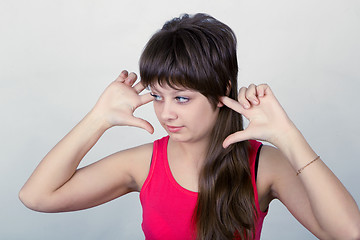 Image showing young girl stopped up their ears