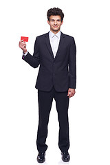 Image showing Smiling business man showing blank credit card