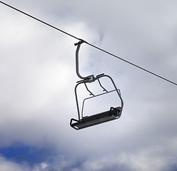 Image showing Chair-lift and cloudy sky
