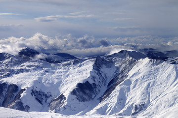 Image showing Winter mountains in clouds at windy day