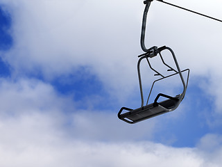 Image showing Chair-lift and blue sky with clouds