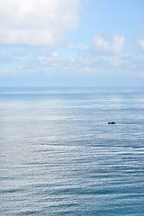 Image showing Clouds above a surface of the sea