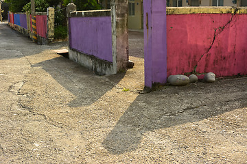 Image showing Aged colorful stone fence