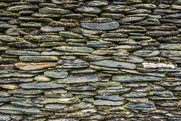 Image showing Stone wall with green moss