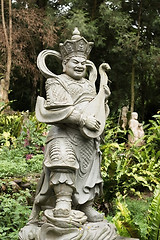 Image showing Aged asian god statue