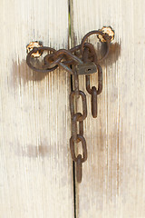 Image showing Old door with lock and chain