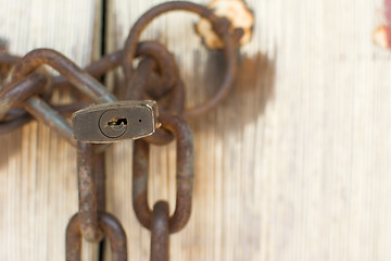 Image showing Old door with lock and chain