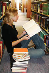 Image showing girl reading in the library