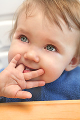 Image showing baby chewing on a finger