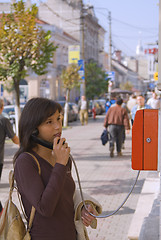 Image showing Woman at the public phone