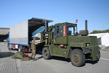 Image showing Big military forklift in action