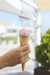 Image showing Hand holding pink ice-cream