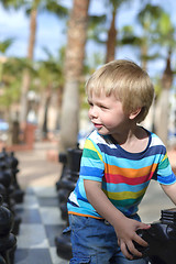 Image showing Child playing with giant chess