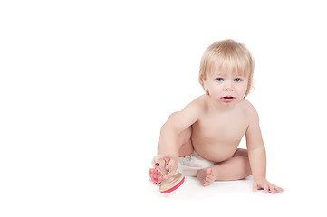 Image showing Serious baby boy watching on you