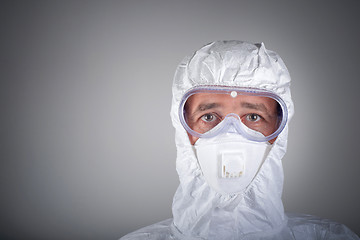 Image showing Scientist in protective wear, glasses, respirator