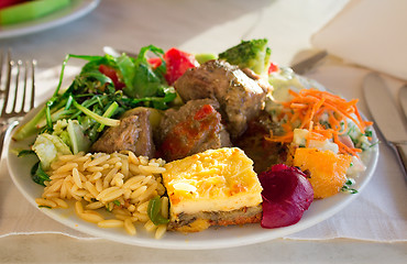 Image showing Omelet and stewed meat with rice and vegetables.