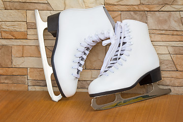 Image showing The female skates and boots of white color for figure skating.