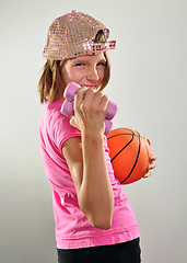 Image showing child exercising with dumbbells and ball