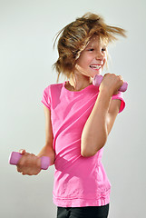 Image showing child exercising with dumbbells