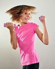 Image showing child exercising with dumbbells