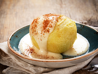 Image showing baked apple dessert with vanilla sauce