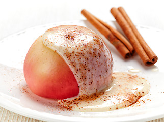 Image showing baked apple dessert with vanilla sauce