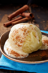Image showing baked apple dessert with vanilla sauce